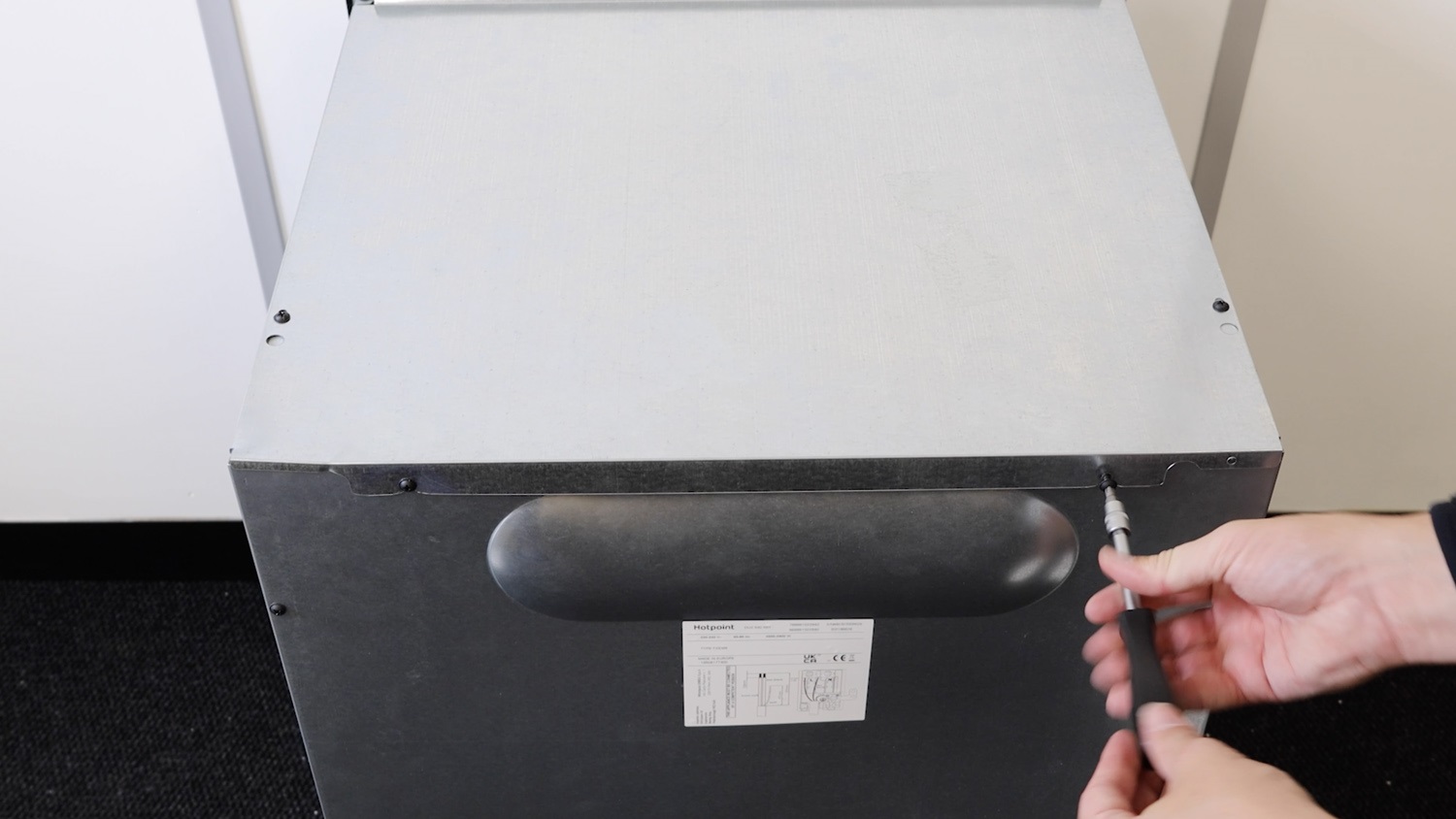 Re-screw screws on rear panel